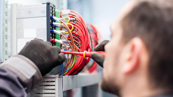 Technician working on computer hardware.